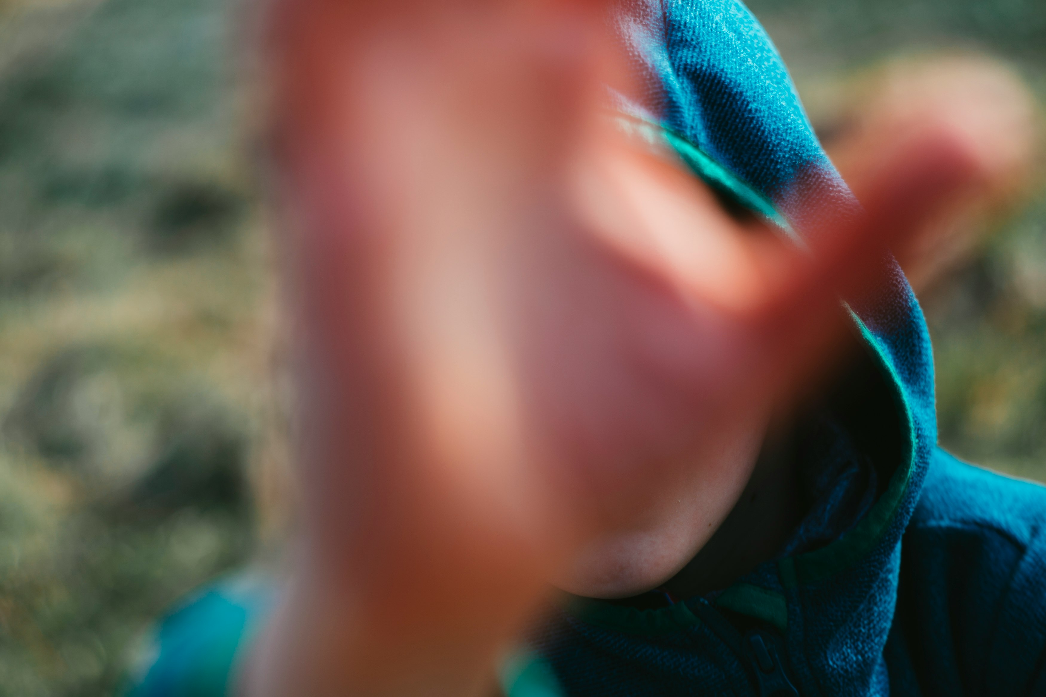 person in blue and green jacket